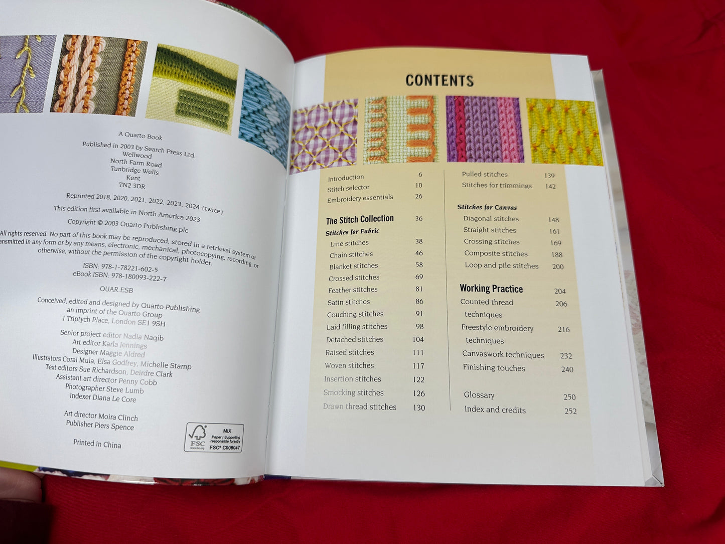 Interior view of Embroidery Stitch Bible showing the contents page with various stitch examples and text on red background.