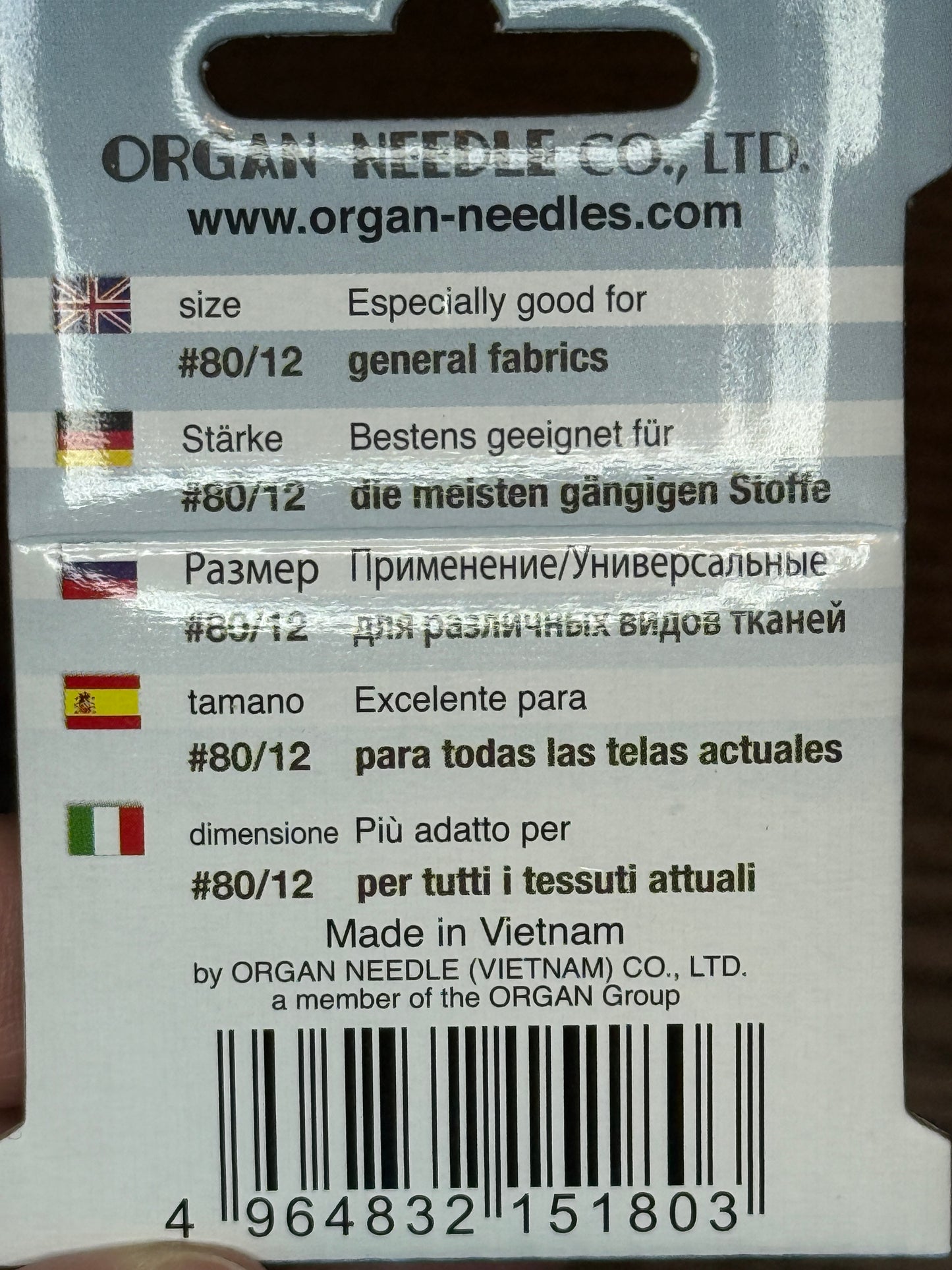 Organ Needles Universal Size 80/12 packaging with multilingual description for sewing on general fabrics, made in Vietnam.