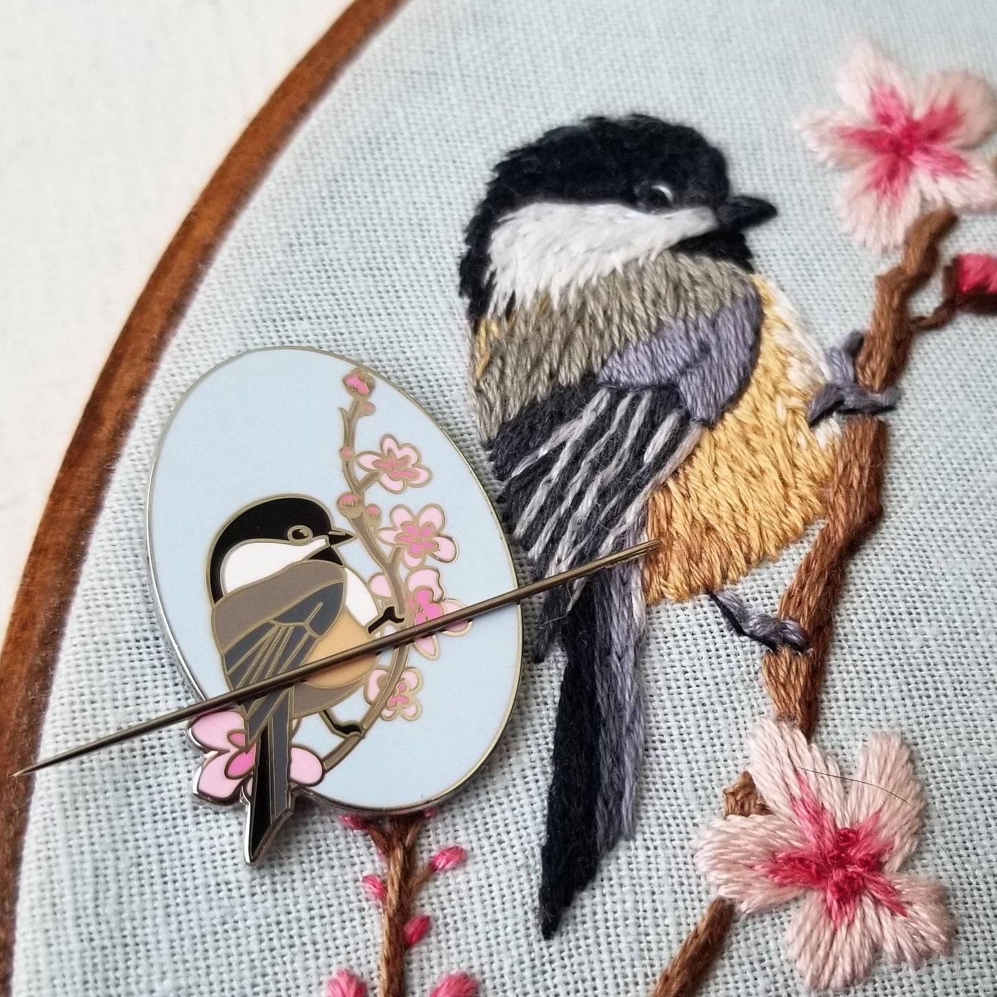 Chickadee Enamel Needle Minder with magnetic pin and raised silver plating.