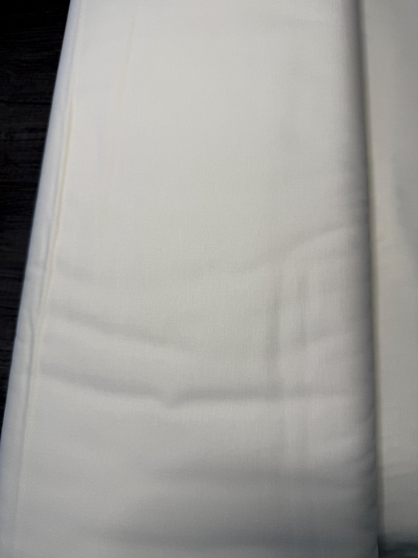 Moda Bella Solids SNOW 9900 11 cotton fabric in natural color, 44-45 inches wide, close-up view.