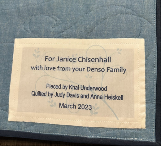 Quilt label with dedication, pieced by Khai Underwood, quilted by Judy Davis and Anna Heiskell, March 2023.