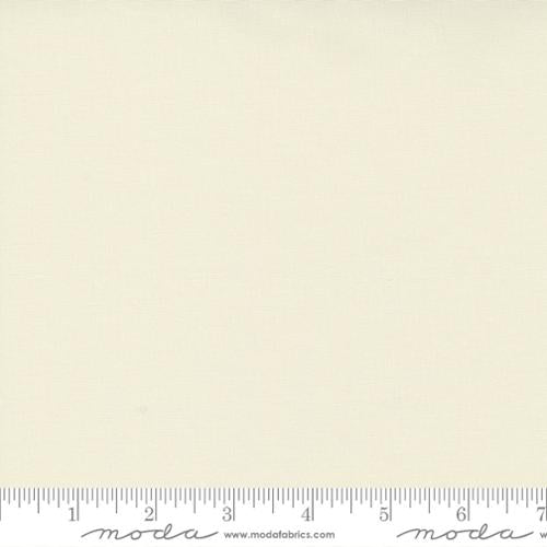 Ivory quilt fabric sample with a ruler scale showing measurement details from Moda Fabrics