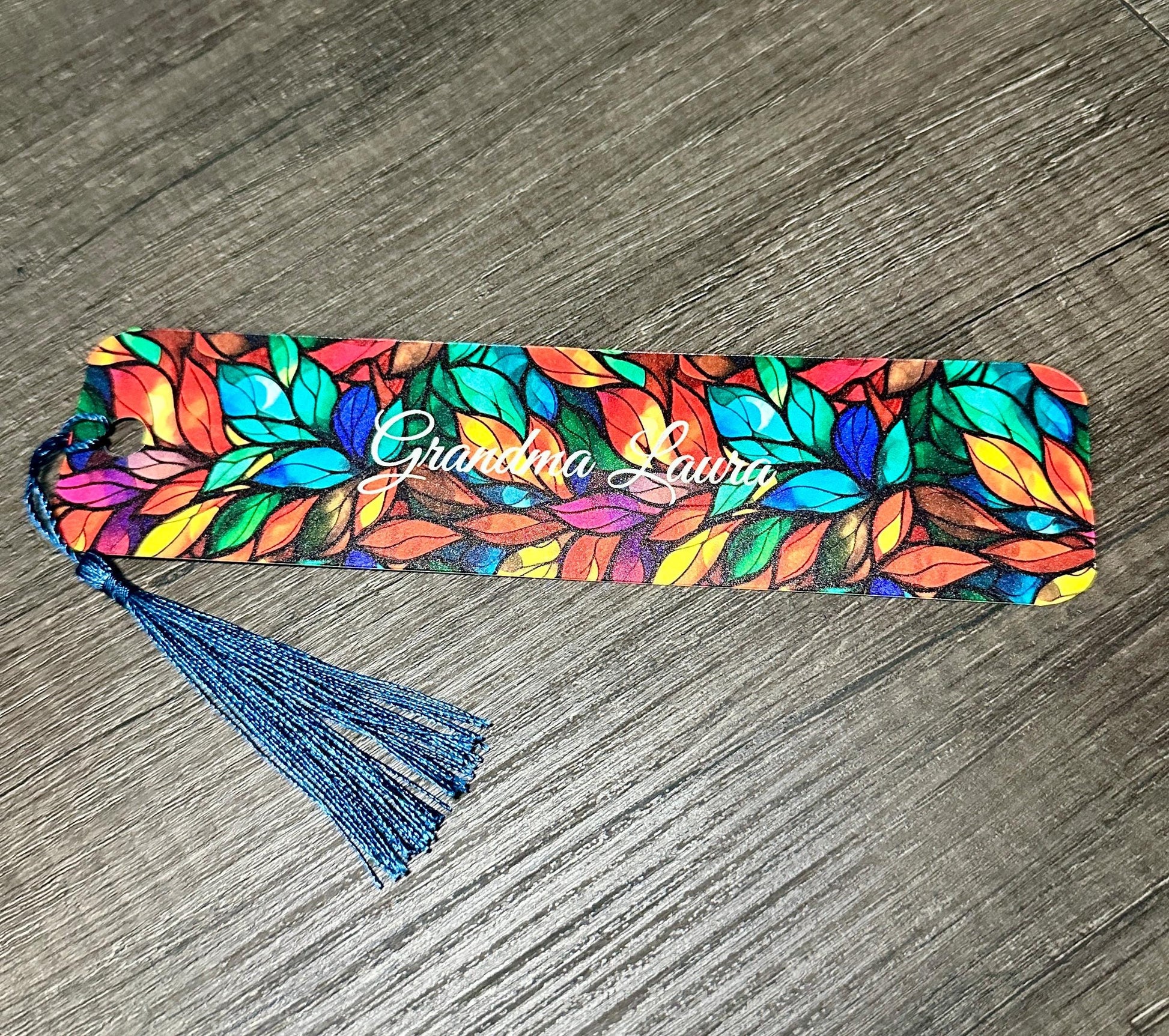 Personalized bookmark with stained glass design and blue tassel, showing faith and grace. Bookmarks Faith Cross Looks Like Stained Glass Amazing Grace.