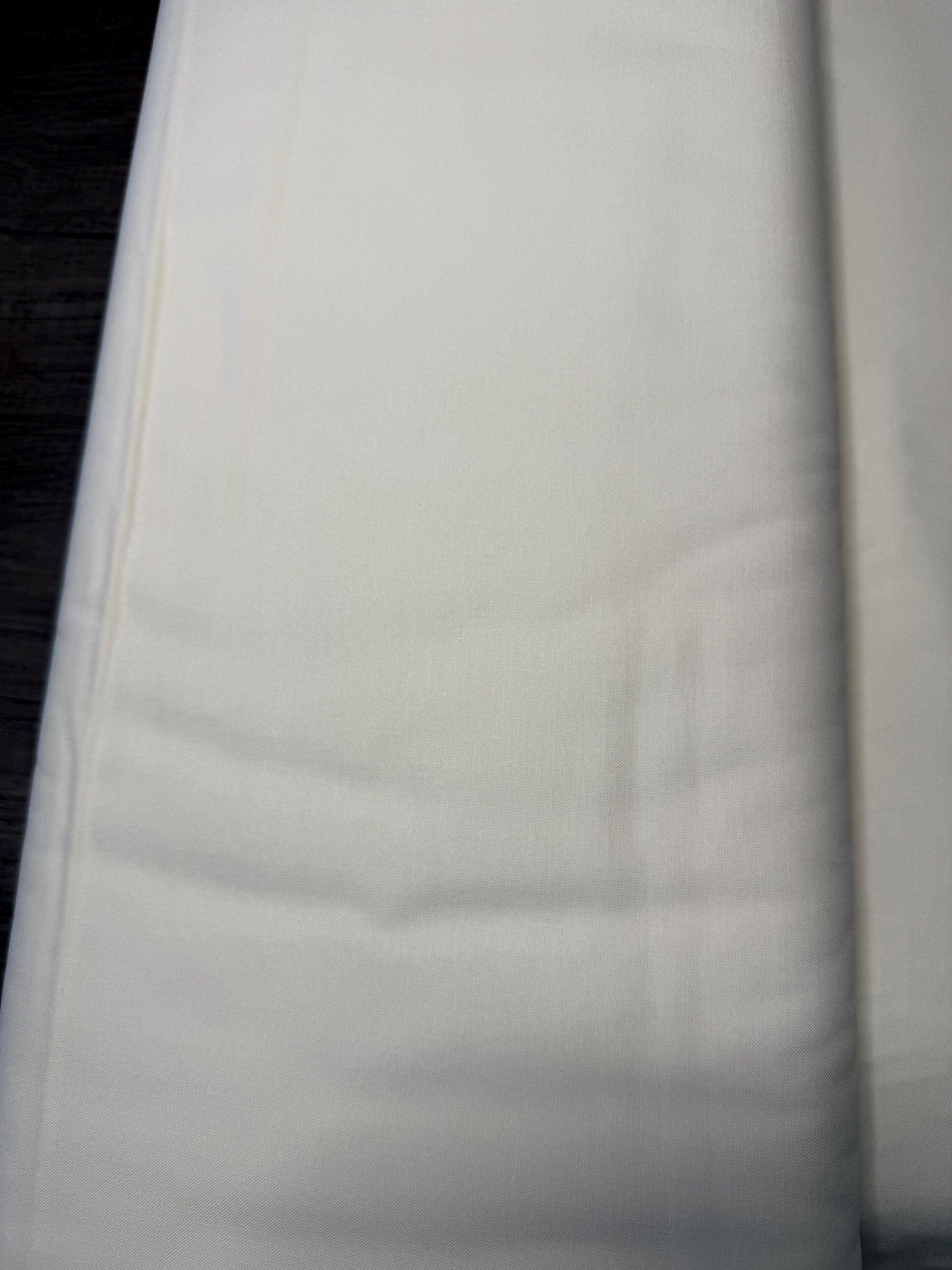 Moda Bella Solids SNOW 9900 11 cotton fabric in natural color, 44-45 inches wide, close-up view.