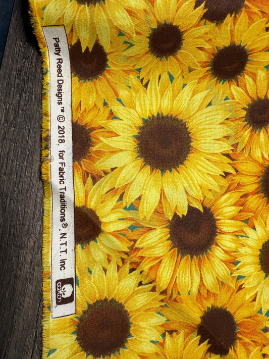 Sunflower Garden Cotton Fabric featuring vibrant yellow sunflowers on 100% cotton, ideal for sewing and crafts, sold by the yard.