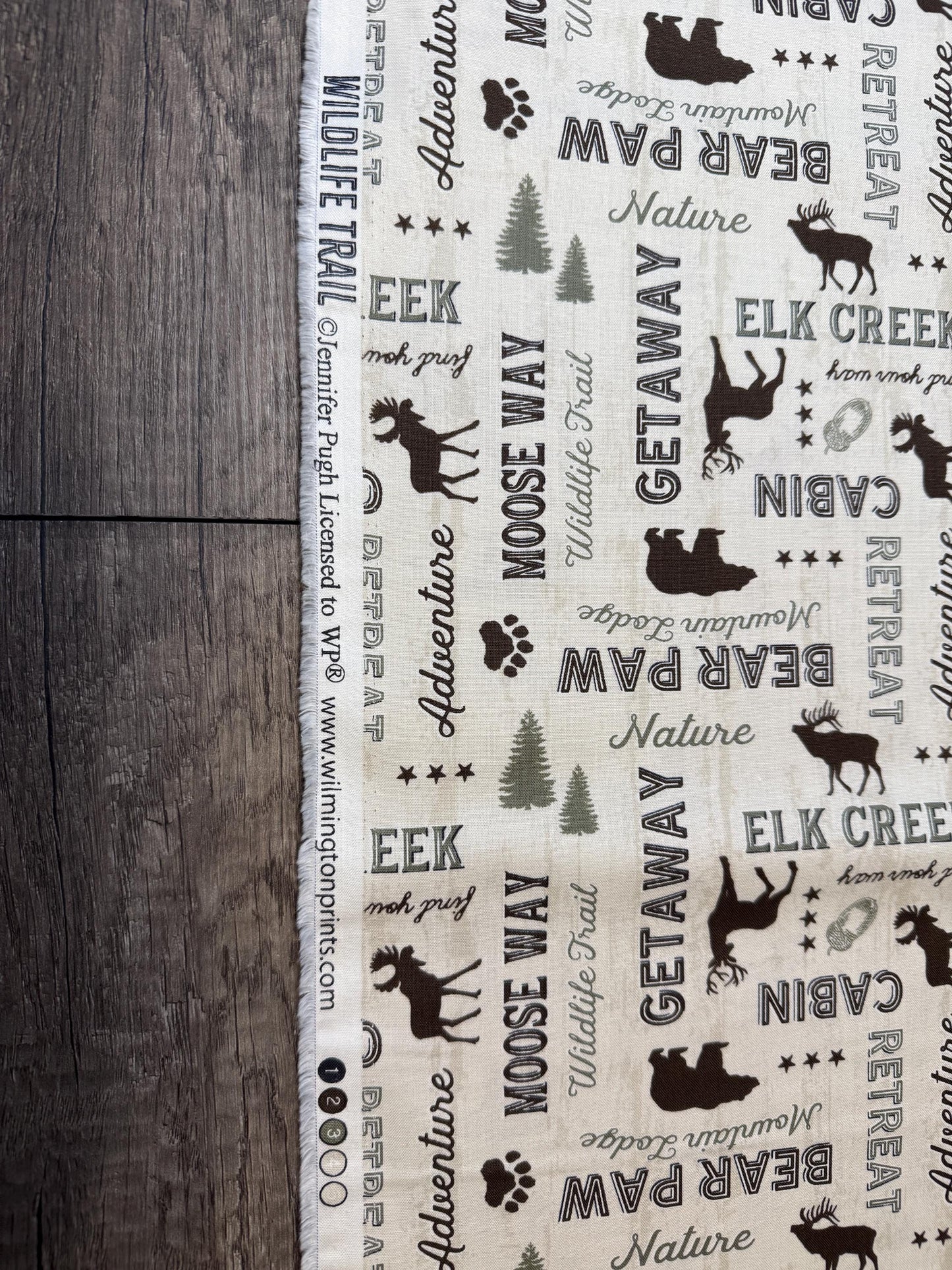 Wildlife Trail 82662-227 Cotton Fabric featuring wildlife and nature patterns, ideal for wildlife lovers. 100% cotton by Jennifer Pugh.