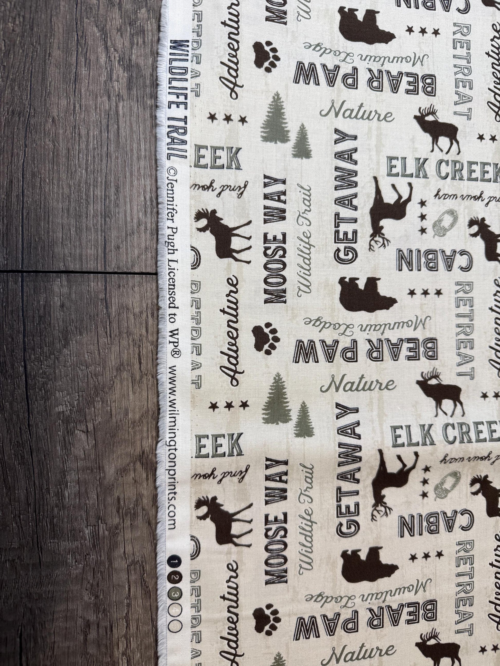 Wildlife Trail 82662-227 Cotton Fabric featuring wildlife and nature patterns, ideal for wildlife lovers. 100% cotton by Jennifer Pugh.