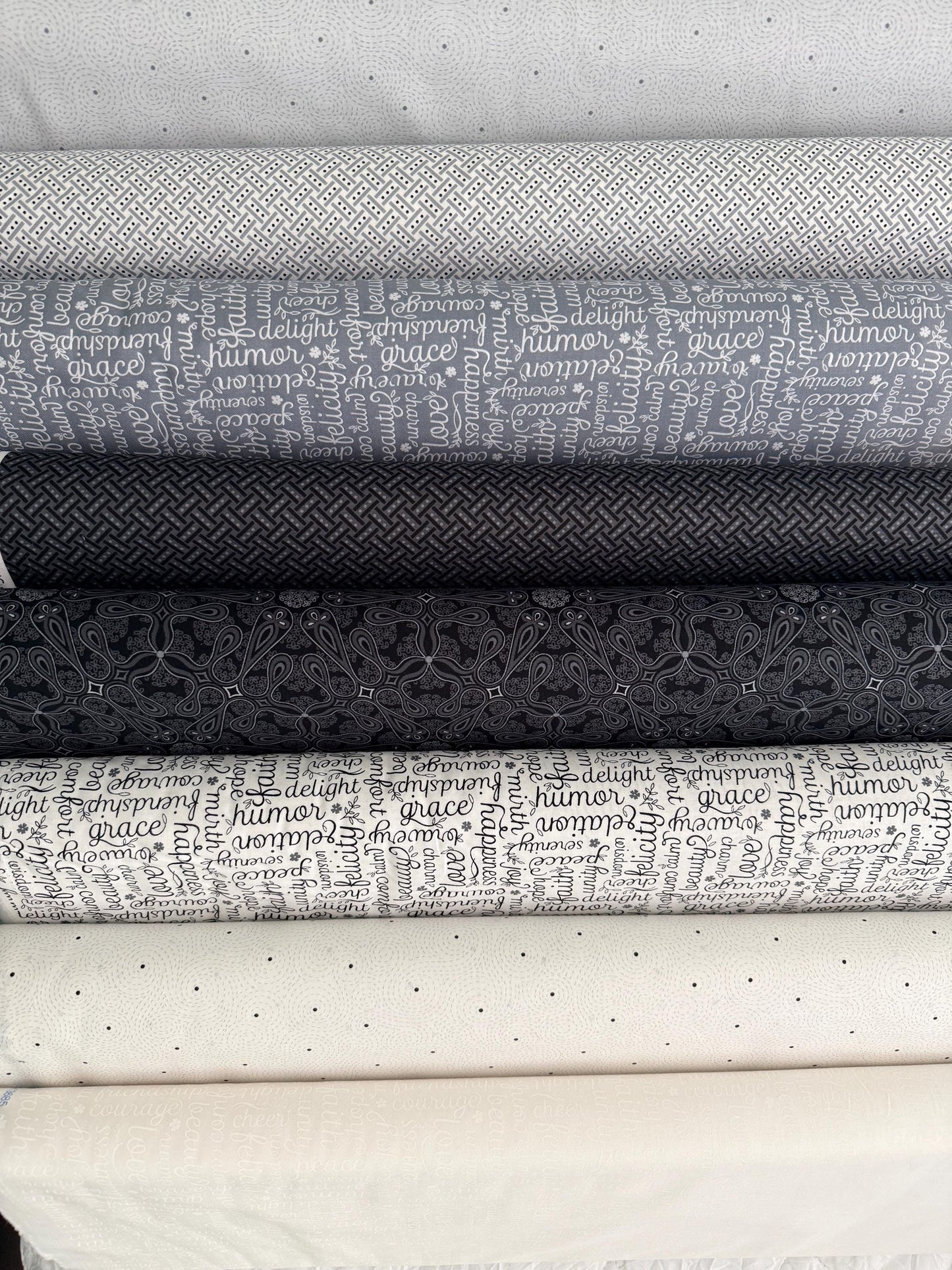 Cotton Fabric White Black Grey Benartex Botanica bundle showcasing various patterns including swirls, script, and basketweave.