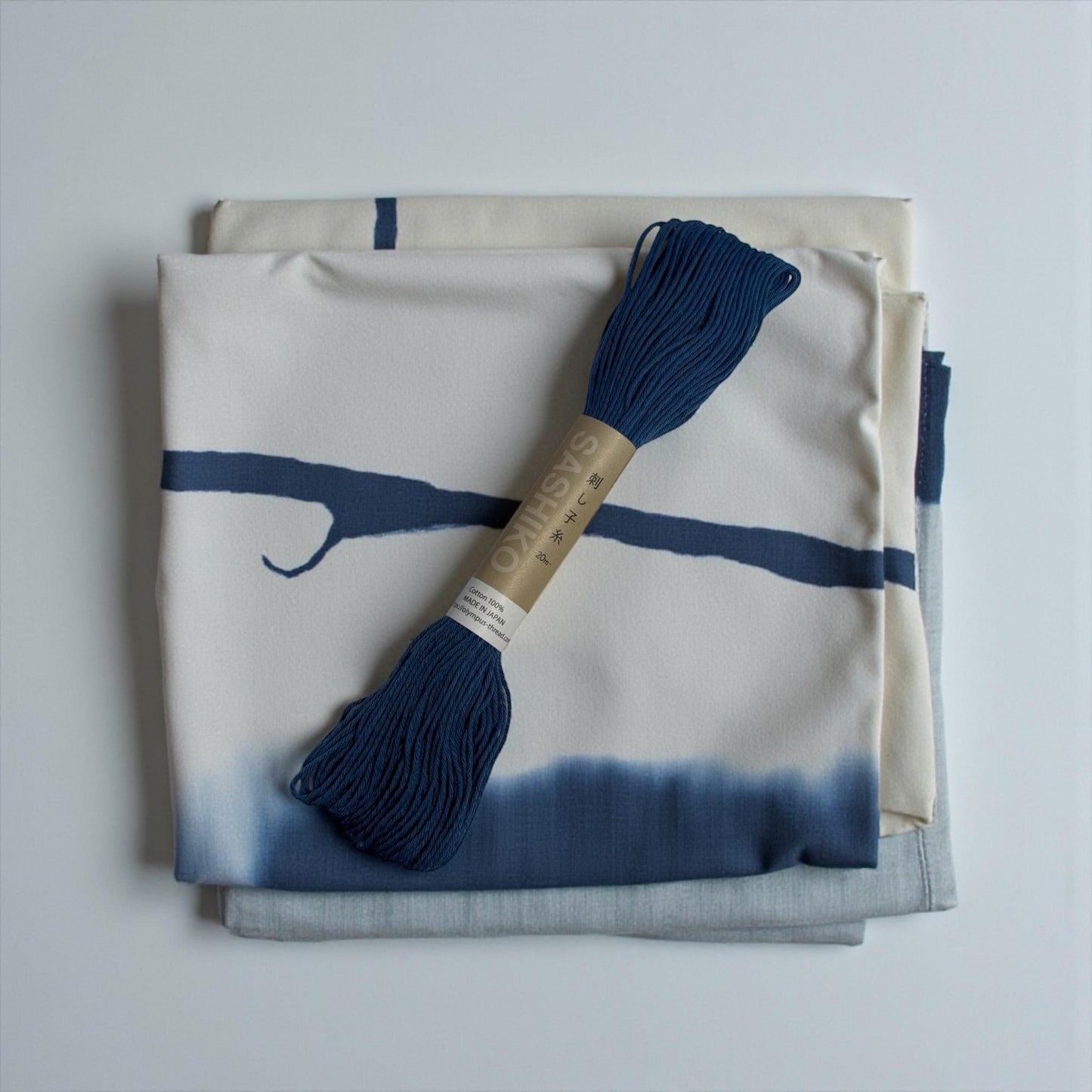 Olympus Sashiko Thread laying on decorative towel