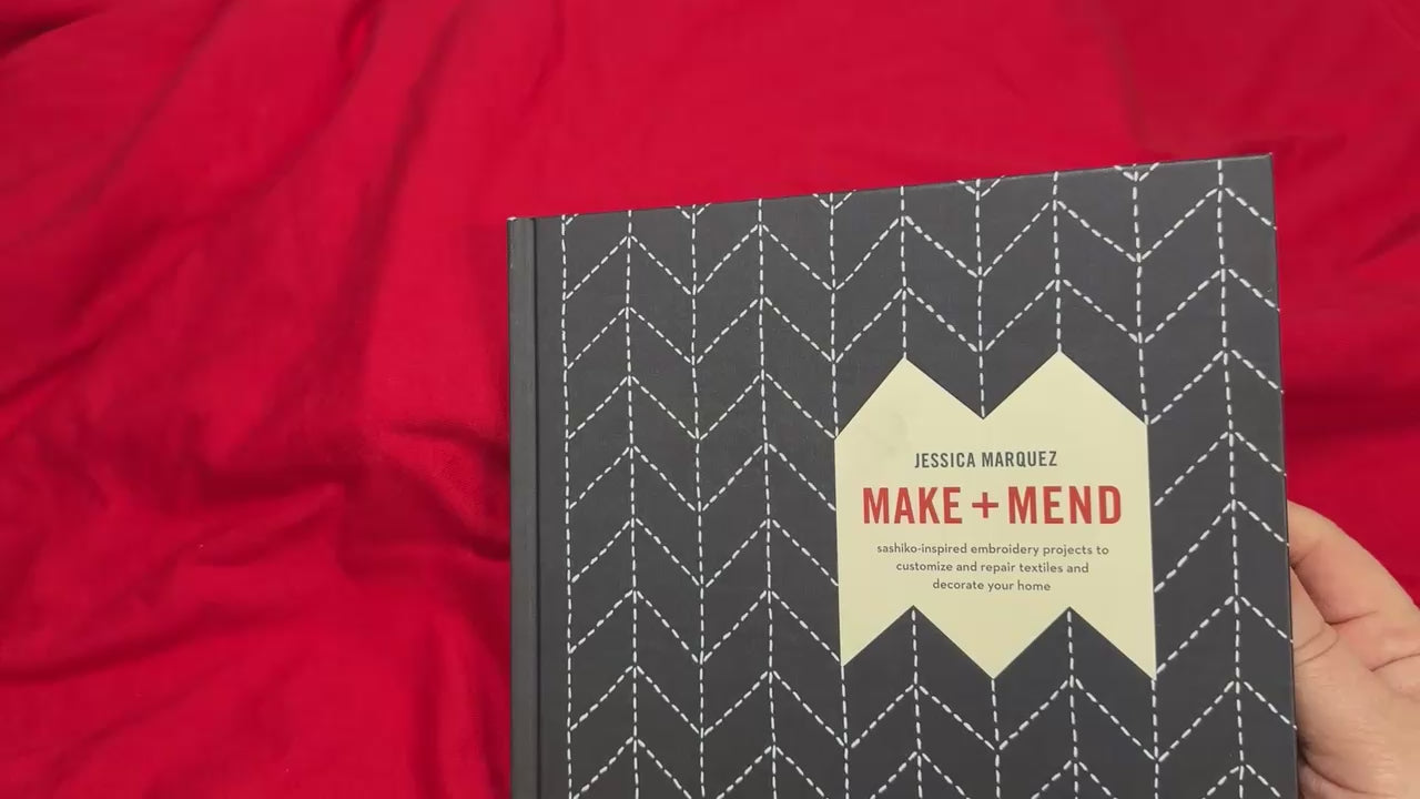 Book titled 'Make and Mend' about sashiko sewing technique, ideal for learning and decorative projects.